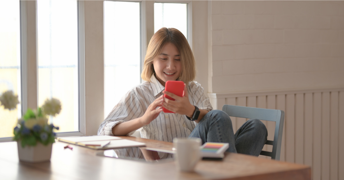 Woman_Sat_on_Phone_With_Coffee
