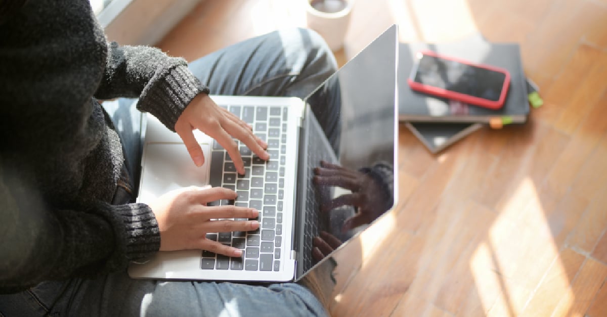 Girl in Grey Jumper Studying on Laptop at Home